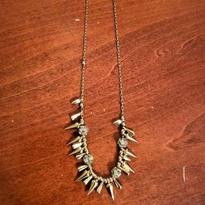 Costume gold necklace with spike detail